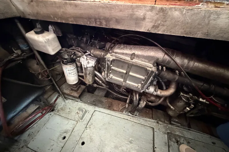 Slide: The Image of Engine compartment of a 1989 Egg Harbor 41 Convertible boat, showing mechanical components. - 50