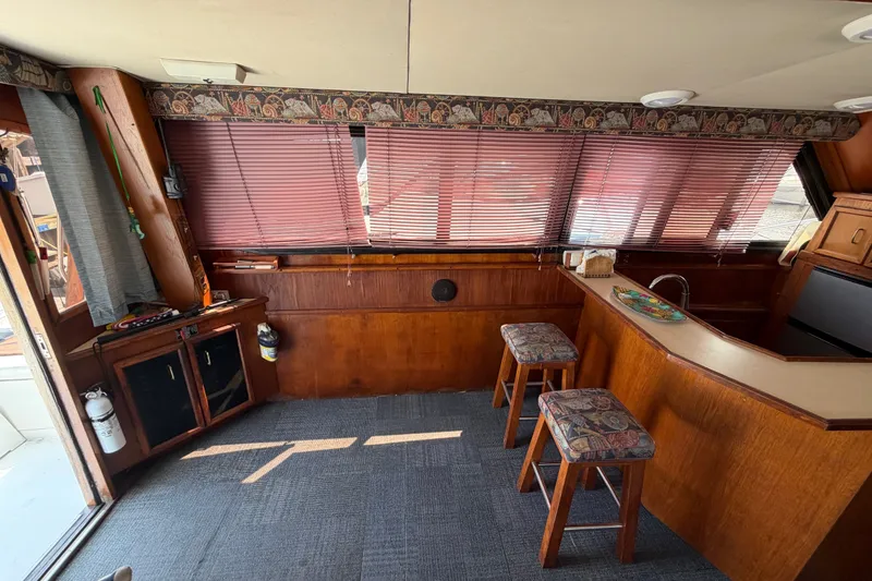 Slide: The Image of Interior of 1989 Egg Harbor 41 Convertible yacht with bar and stools. - 13