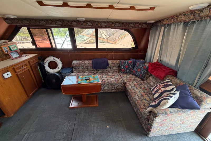 Slide: The Image of Interior of 1989 Egg Harbor 41 Convertible yacht with cozy seating and nautical decor. - 12