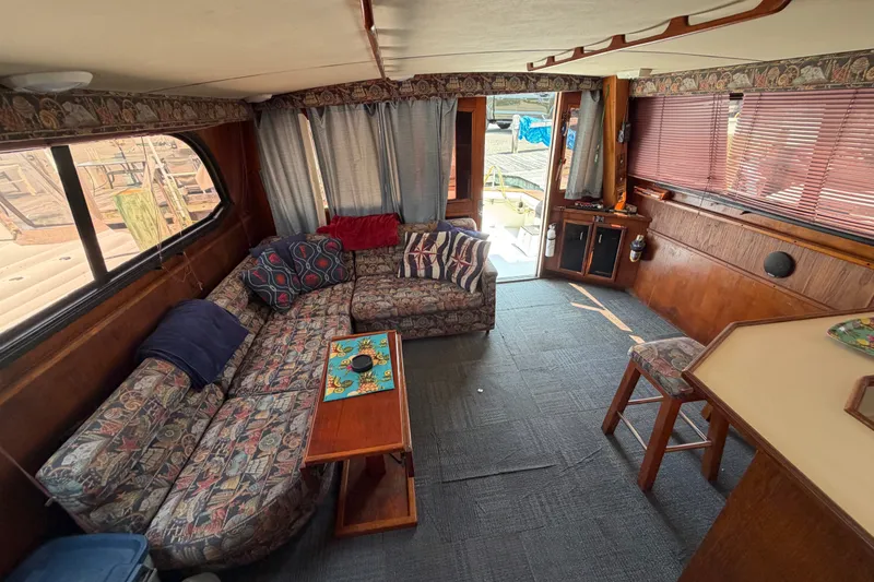 Slide: The Image of Interior of 1989 Egg Harbor 41 Convertible yacht with cozy seating and nautical decor. - 20