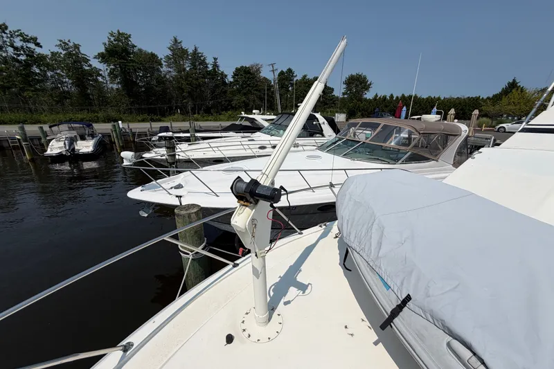 Slide: The Image of 1989 Egg Harbor 41 Convertible yacht docked at marina with other boats. - 43