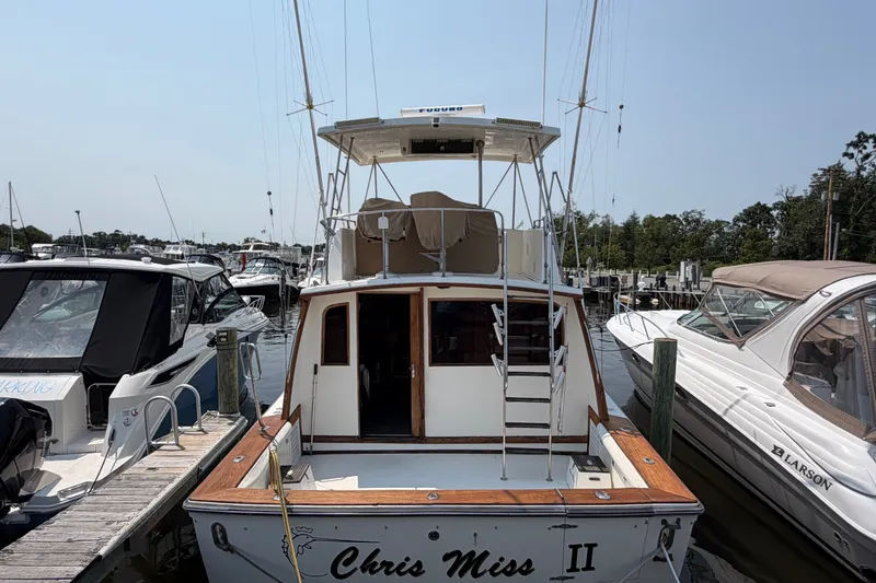 Slide: The Image of 1989 Egg Harbor 41 Convertible yacht docked at marina, rear view. - 2