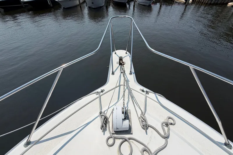 Slide: The Image of Bow view of 1989 Egg Harbor 41 Convertible yacht docked at marina. - 42