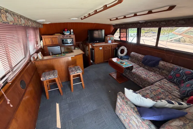 Slide: The Image of Interior of 1989 Egg Harbor 41 Convertible yacht with cozy seating and kitchenette. - 11