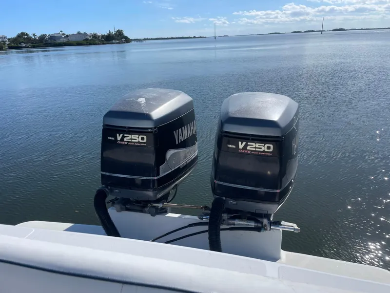 Slide: The Image of Twin Yamaha V250 outboard motors on a 2001 Jupiter 31 Cuddy boat. - 4