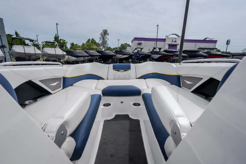 Slide: The Image of Interior of 2012 MasterCraft X55 boat with white and blue seating. - 31
