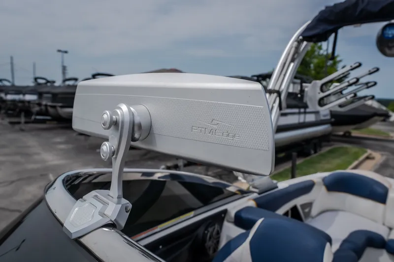Slide: The Image of 2012 MasterCraft X55 boat with a sleek rearview mirror and luxurious seating. - 36