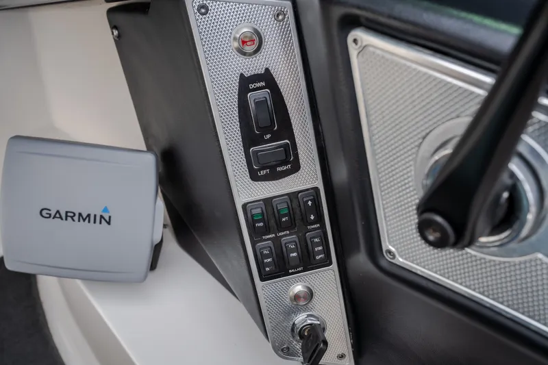 Slide: The Image of Control panel of a 2012 MasterCraft X55 boat with Garmin device. - 44
