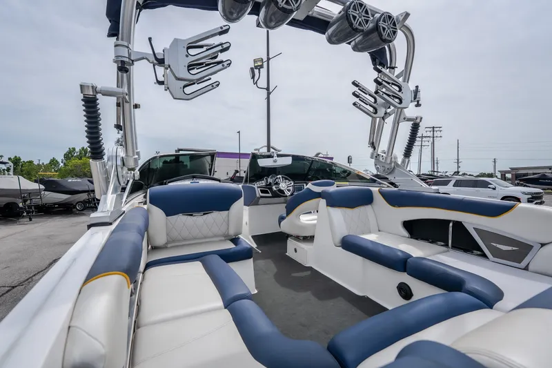 Slide: The Image of Interior of 2012 MasterCraft X55 boat with blue and white seating, showcasing luxury design. - 18