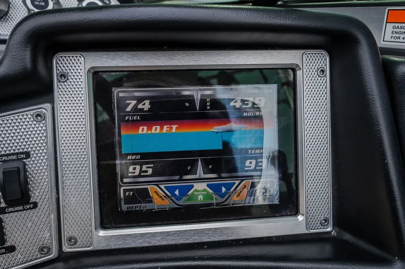 Slide: The Image of Dashboard display of a 2012 MasterCraft X55 boat showing fuel, hours, and temperature. - 41