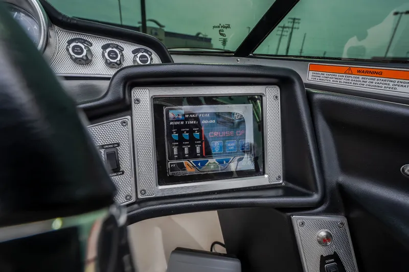 Slide: The Image of 2012 MasterCraft X55 dashboard with touchscreen display and control panel. - 42