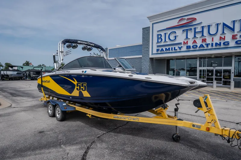 Slide: The Image of 2012 MasterCraft X55 boat on trailer at Big Thunder Marine dealership. - 10