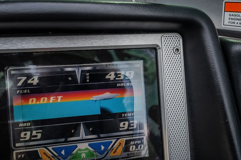 Slide: The Image of Close-up of 2012 MasterCraft X55 dashboard display showing fuel, hours, and temperature. - 40