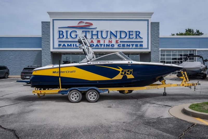 Slide: The Image of 2012 MasterCraft X55 boat on trailer at Big Thunder Marine dealership. - 7