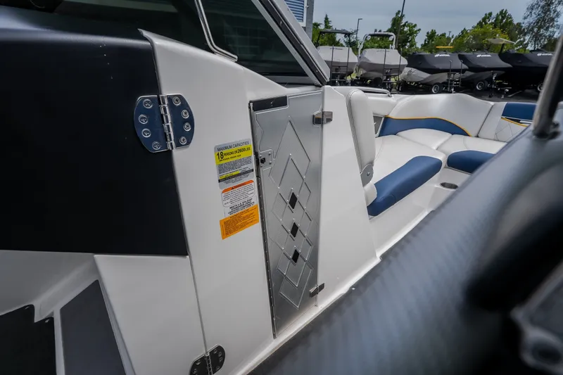 Slide: The Image of 2012 MasterCraft X55 boat interior with seating and safety capacity label. - 30
