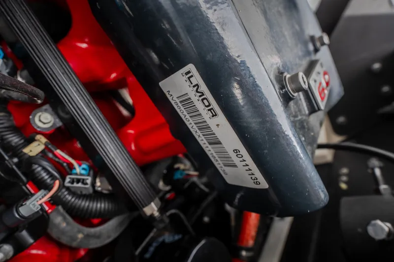 Slide: The Image of Close-up of a 2012 MasterCraft X55 engine component with Ilmor branding. - 49
