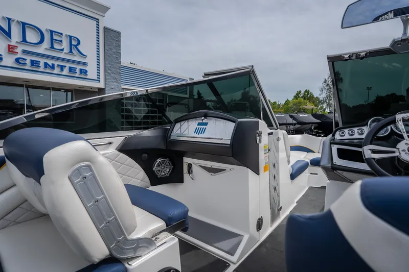 Slide: The Image of Interior view of a 2012 MasterCraft X55 boat at a dealership. - 23