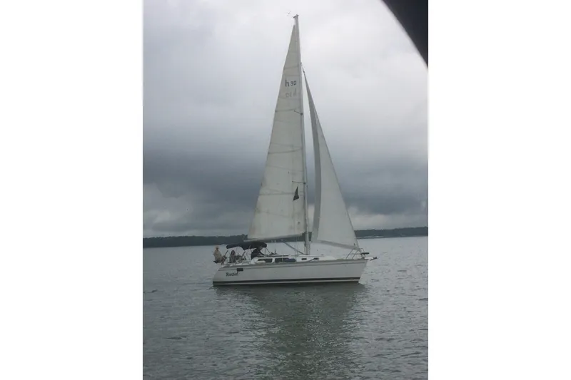The Image of Sailboat on water, 1993 Hunter Marine 30, overcast sky. - 1