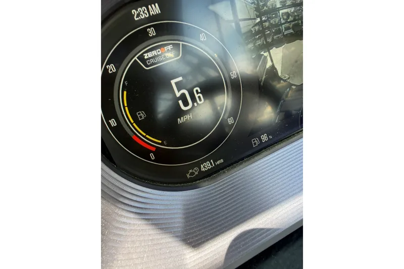 Slide: The Image of Dashboard of 2021 MasterCraft X24 showing speed at 5.6 MPH and fuel level. - 13