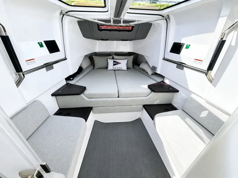 Slide: The Image of Interior of the 2022 Axopar Brabus 37 XC Cross Cabin with gray upholstery and modern design. - 28