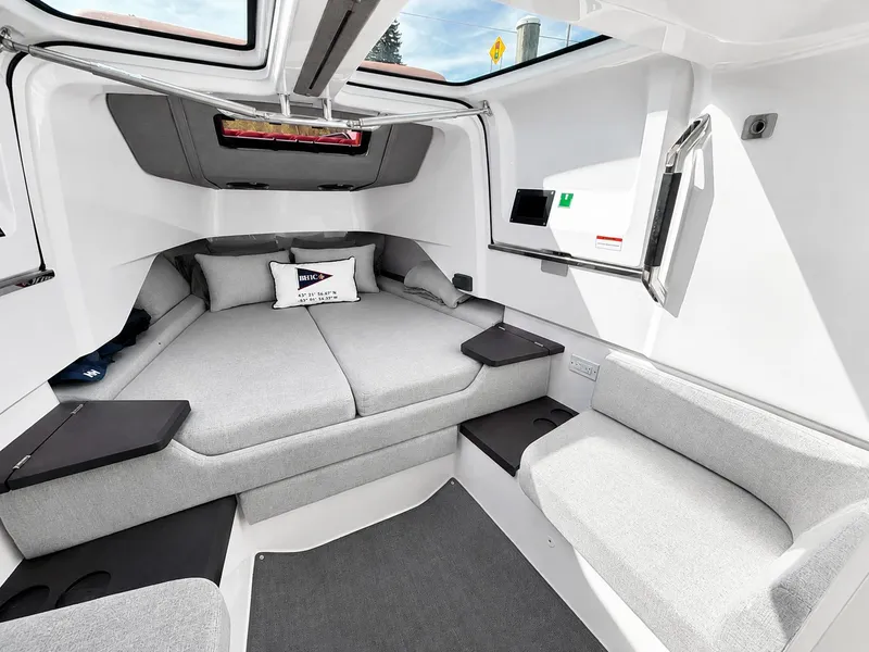 Slide: The Image of Interior of the 2022 Axopar Brabus 37 XC Cross Cabin with gray upholstery and modern design. - 29