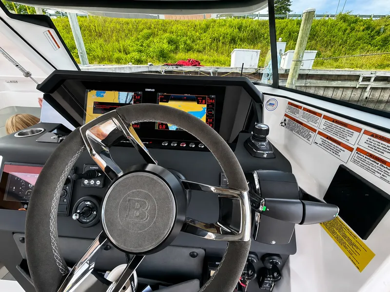 Slide: The Image of The image shows the helm of a 2022 Axopar Brabus 37 XC Cross Cabin. - 31