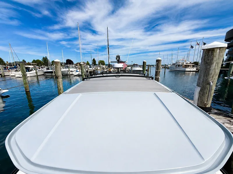 Slide: The Image of The image shows the roof of a 2022 Axopar Brabus 37 XC Cross Cabin in a marina. - 38