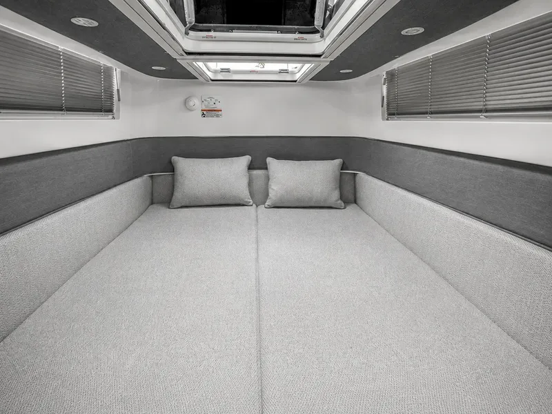 Slide: The Image of Interior of the 2022 Axopar Brabus 37 XC Cross Cabin with gray upholstery and a skylight. - 36
