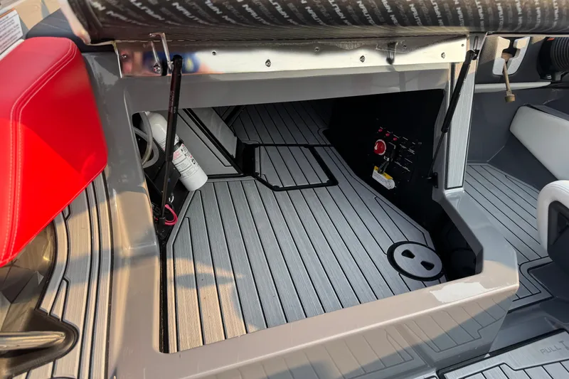 Slide: The Image of 2024 Nautique Ski Nautique interior with red seating and modern deck design. - 30