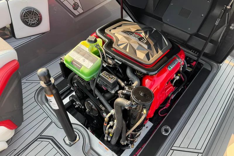 Slide: The Image of 2024 Nautique Ski Nautique engine compartment with vibrant red and black components. - 17