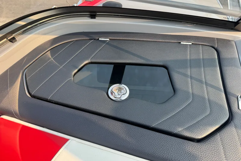 Slide: The Image of 2024 Nautique Ski Nautique dashboard with sleek black leather detailing and modern design. - 11