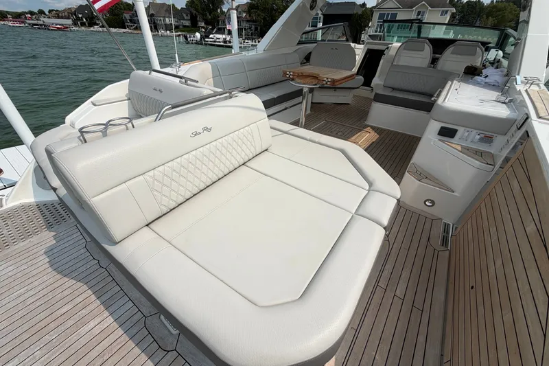 Slide: The Image of Luxurious 2023 Sea Ray SLX 400 boat interior with elegant seating and teak flooring. - 30