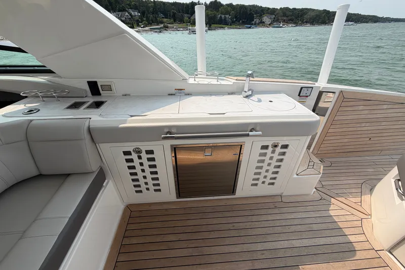 Slide: The Image of Luxurious 2023 Sea Ray SLX 400 yacht deck with sleek kitchen and scenic water view. - 24
