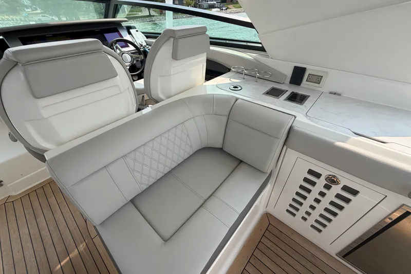 Slide: The Image of Luxurious interior of 2023 Sea Ray SLX 400 yacht with elegant seating and modern controls. - 23