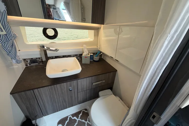 Slide: The Image of Luxurious bathroom interior of 2023 Sea Ray SLX 400 yacht with modern fixtures. - 39