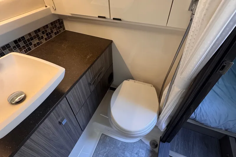 Slide: The Image of Modern bathroom in 2023 Sea Ray SLX 400 boat with sink and toilet. - 42