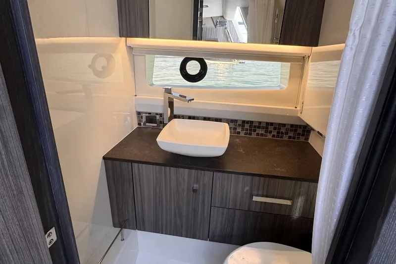Slide: The Image of Modern bathroom interior of 2023 Sea Ray SLX 400 yacht with sleek design. - 41