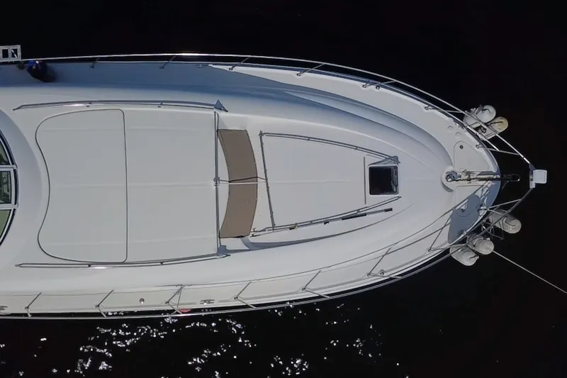 Slide: The Image of Aerial view of 2003 Sea Ray 480 Motor Yacht, showcasing sleek deck design. - 200