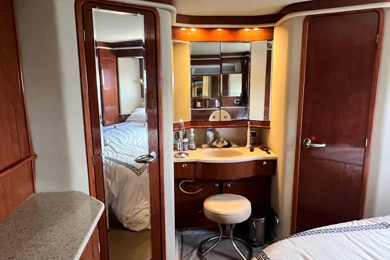 Slide: The Image of Luxurious 2003 Sea Ray 480 Motor Yacht interior with vanity and bedroom view. - 139