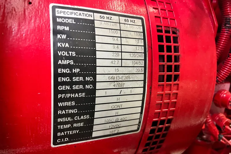 Slide: The Image of Close-up of a red engine specification label on a 2003 Sea Ray 480 Motor Yacht. - 30