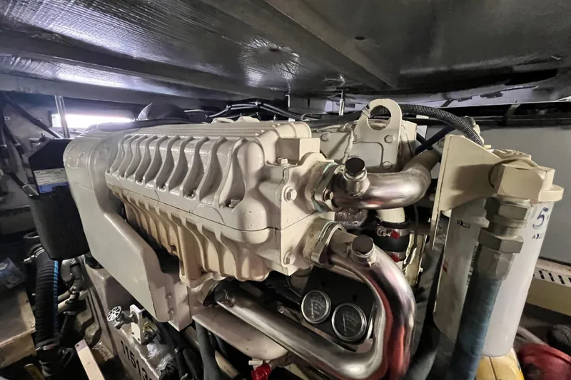 Slide: The Image of Engine room of a 2003 Sea Ray 480 Motor Yacht, showcasing detailed machinery. - 36