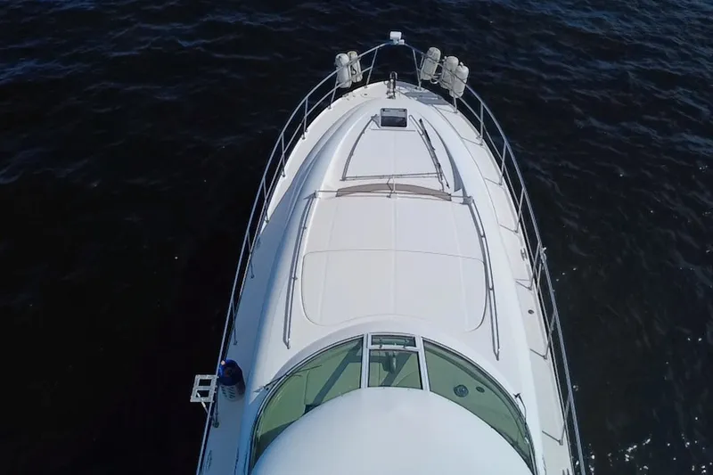 Slide: The Image of Aerial view of 2003 Sea Ray 480 Motor Yacht on dark water. - 215