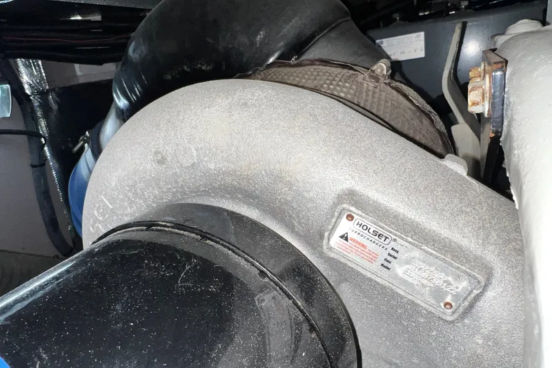Slide: The Image of Engine component of a 2003 Sea Ray 480 Motor Yacht, featuring a Holset turbocharger. - 40