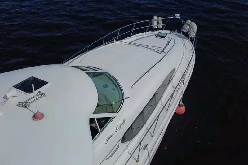 Slide: The Image of 2003 Sea Ray 480 Motor Yacht cruising on open water. - 217