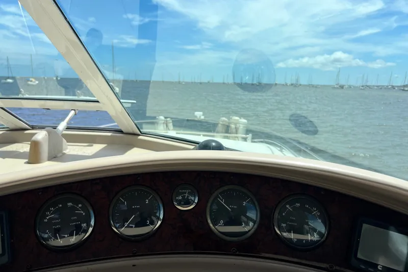 Slide: The Image of Cockpit view from a 2003 Sea Ray 480 Motor Yacht, overlooking a marina. - 87