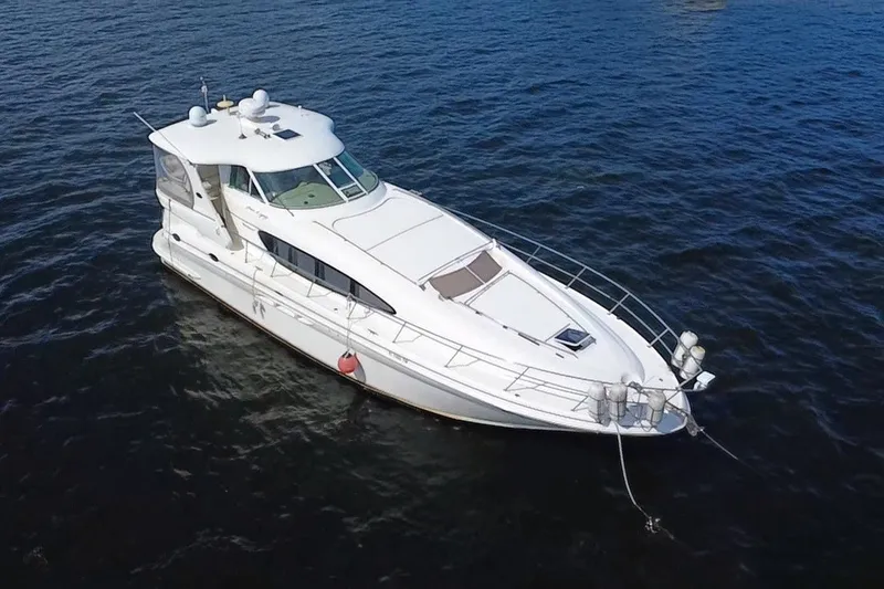 Slide: The Image of 2003 Sea Ray 480 Motor Yacht cruising on open water. - 13