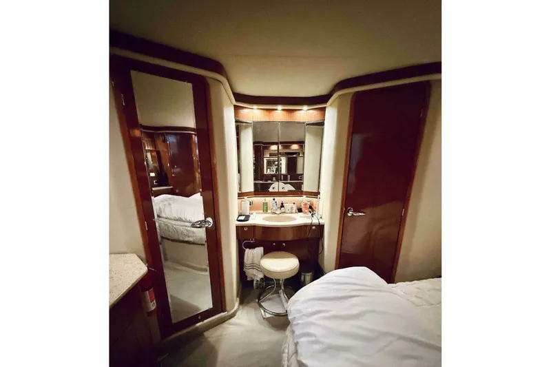 Slide: The Image of Luxurious 2003 Sea Ray 480 Motor Yacht interior with elegant vanity and mirror. - 15