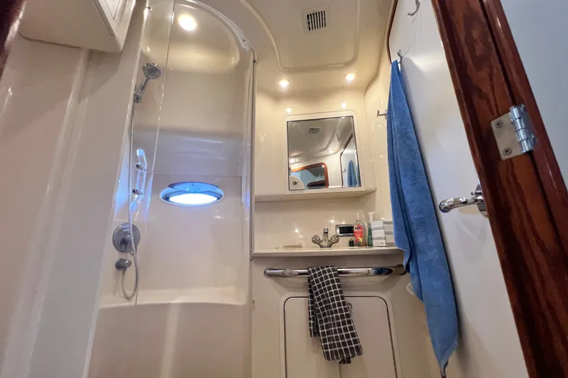 Slide: The Image of Bathroom interior of 2003 Sea Ray 480 Motor Yacht with shower and sink. - 114