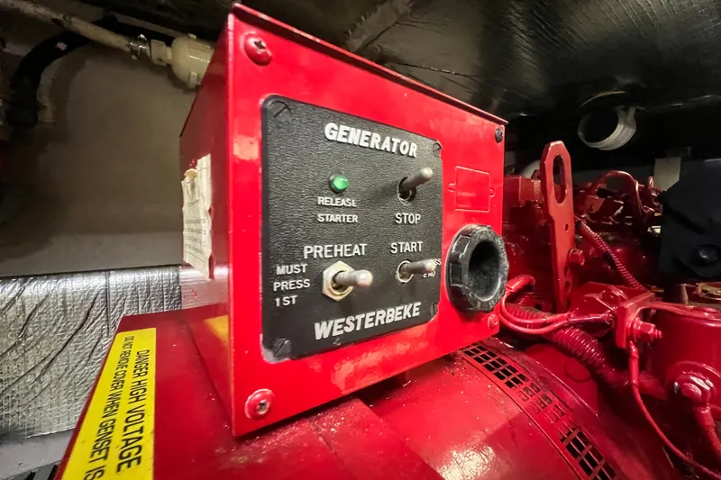 Slide: The Image of Red Westerbeke generator control panel on 2003 Sea Ray 480 Motor Yacht. - 29