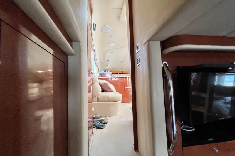 Slide: The Image of Interior view of 2003 Sea Ray 480 Motor Yacht, featuring luxurious seating and wood finishes. - 160